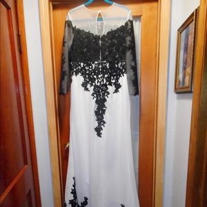 Stunning wedding or formal gown. White with black intricate embroidery.